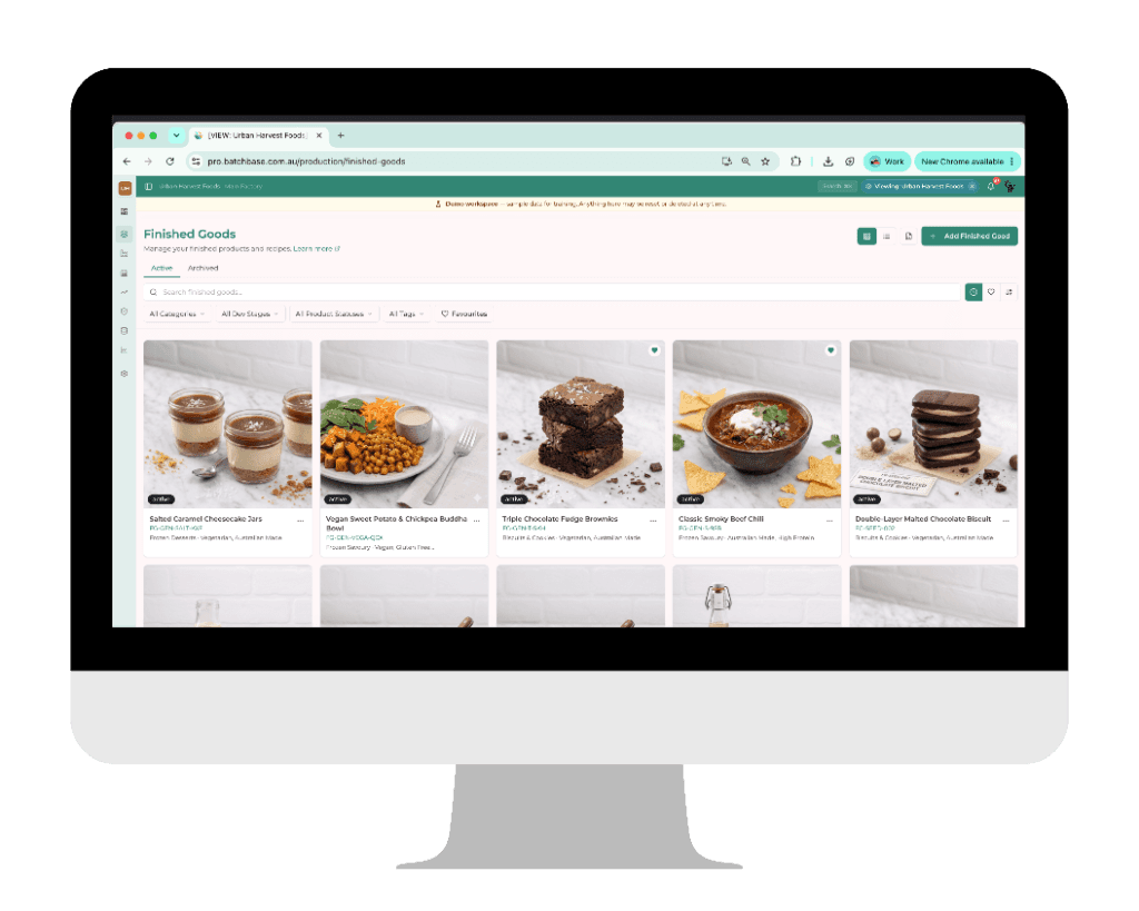 Batchbase finished goods product hub showing food product cards with photos and details inside a modern iMac mockup display